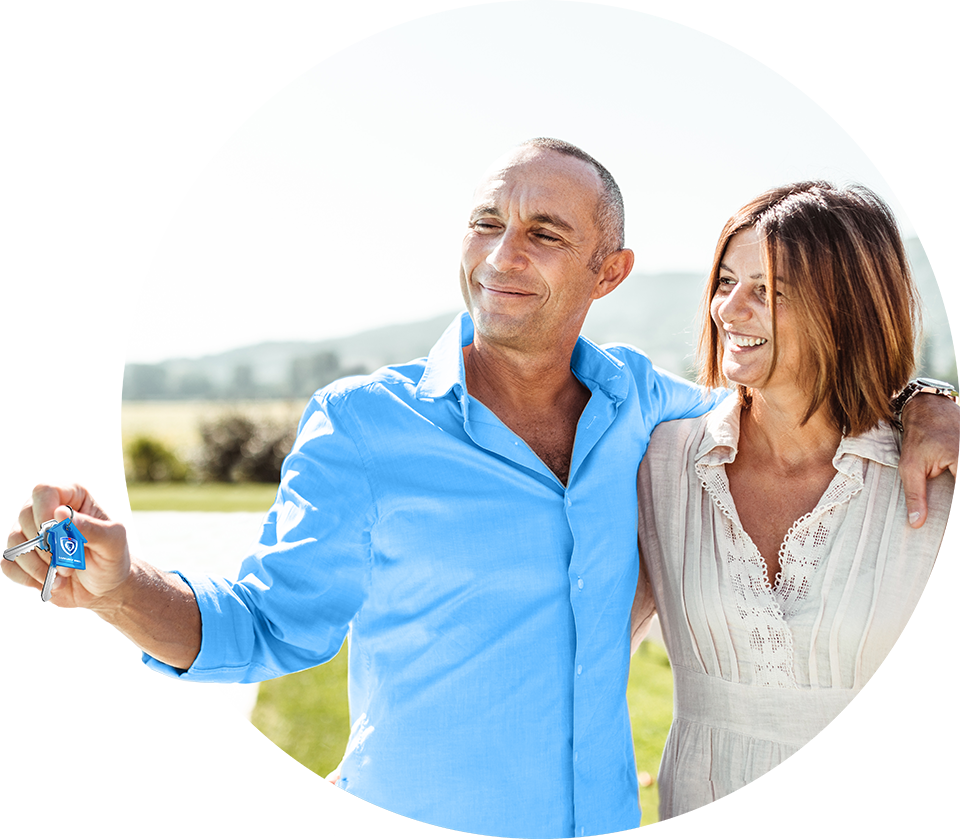Smiling couple holding housekeys